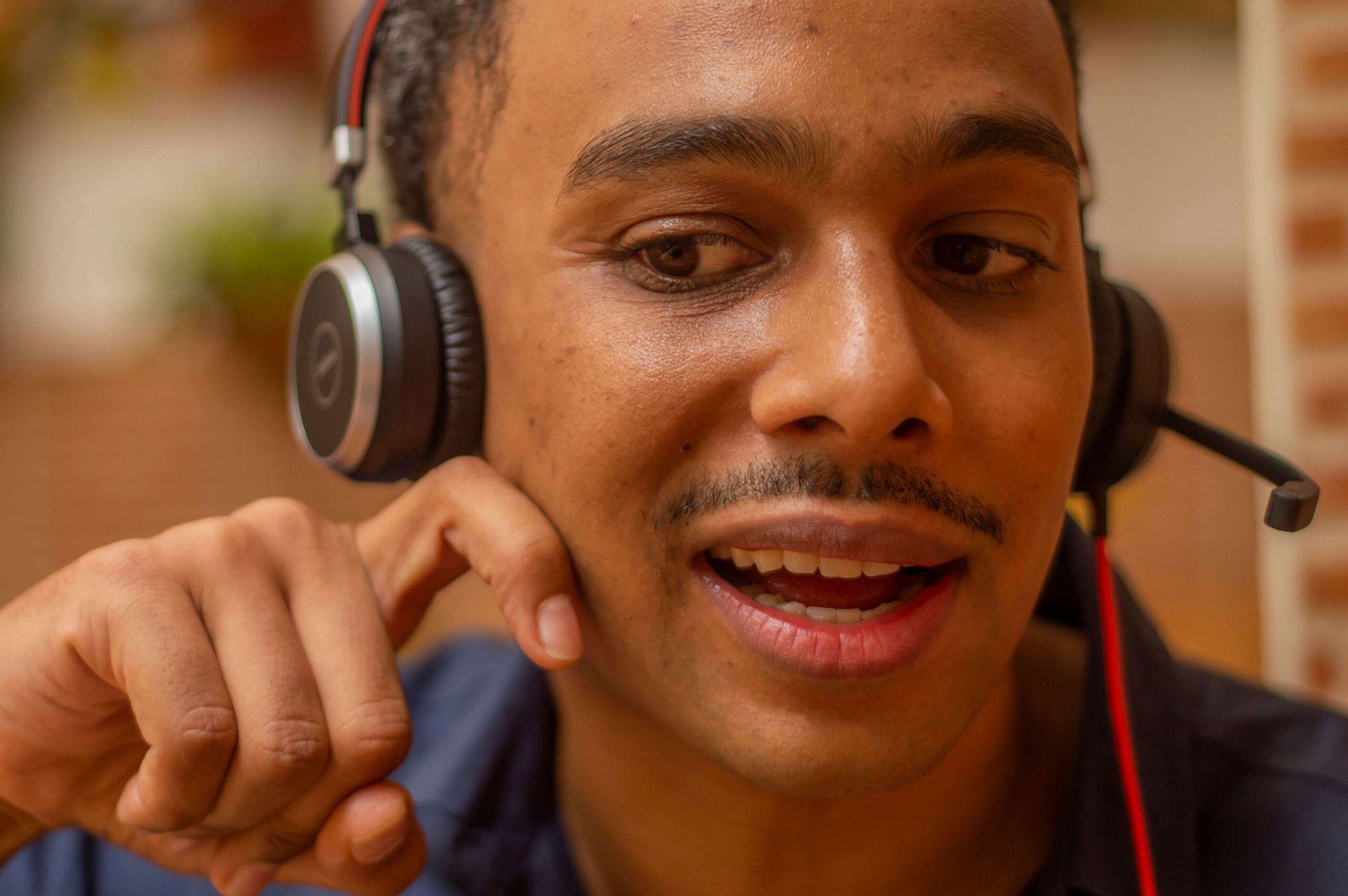 Close-up of Josh demonstrating tongue and mouth position for a target sound